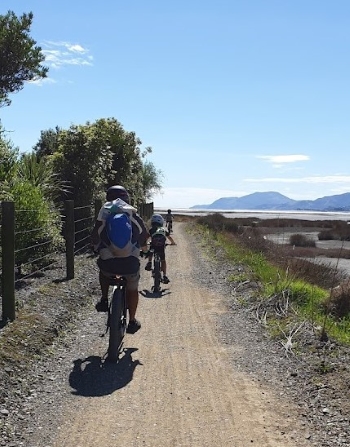 Family riding bikes on the Richmond to Moturoa Family Fun Day 2022